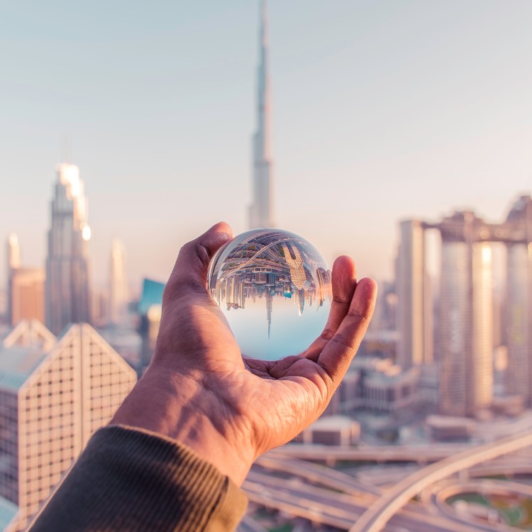 image of man holding glass ball